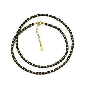 Onyx and gold hematite beaded necklace with round black and metallic beads, featuring a classic design by T.M.J.