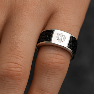 Hoxton London Men's Jewellery sterling silver ring with black leather inlay worn on finger.