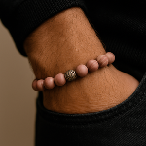 Pink 10mm Striped Jasper Bead Bracelet worn on wrist, handcrafted with stainless steel spacer, enhancing calmness and courage.