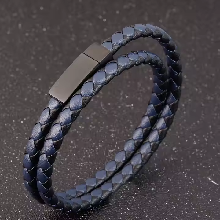 Men’s leather bracelet with black and brown woven pattern and stainless steel clasp.