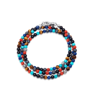 Multi-wrap beaded bracelet with turquoise, red jasper, blue lapis, hematite, and onyx beads.