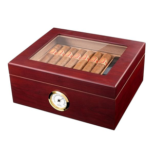 Small wooden cigar humidor with glass top, holds up to 25 cigars, and includes built-in humidifier and hygrometer.