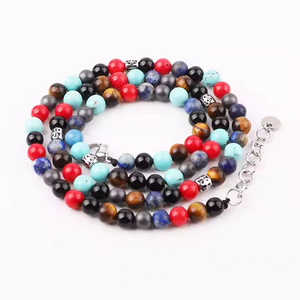Handcrafted multi-wrap beaded bracelet/necklace with turquoise, red jasper, blue lapis, hematite, and onyx beads.