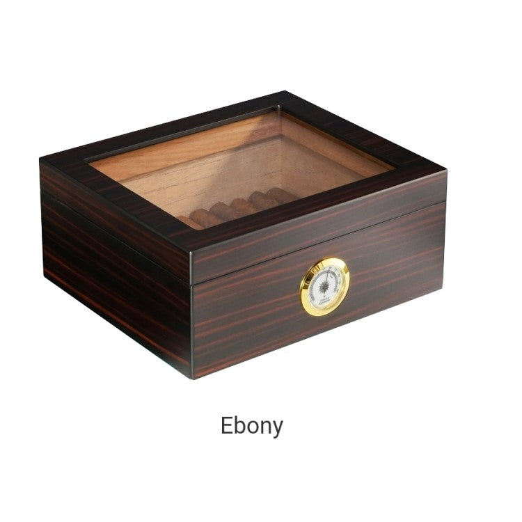 Small wooden cigar humidor with glass top, ebony finish, holds 25 cigars, features hygrometer.