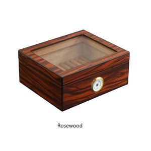 Small wooden cigar humidor with glass top, holds up to 25 cigars, rosewood finish.