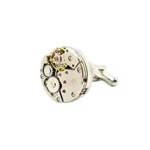 Vintage mechanical watch movement cufflinks with silver-plated backings showcasing intricate gears.