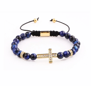 Natural tiger eye beaded bracelet with CZ cross charm in macrame style, featuring 6mm beads and T.M.J brand details.
