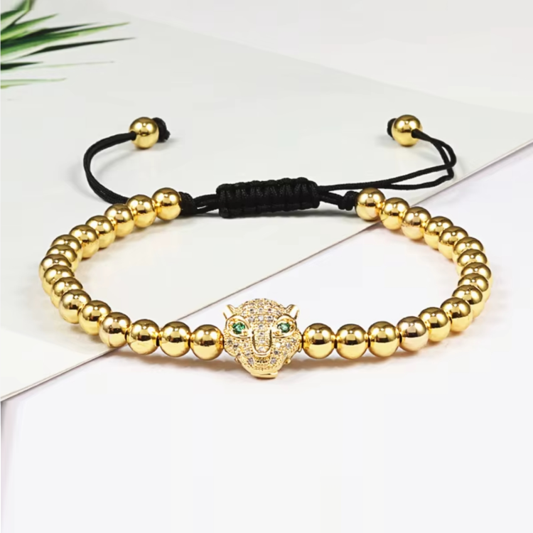 Luxury CZ diamond Puma charm bead macrame bracelet by T.M.J featuring intricate knotting and sparkling gemstone accents.