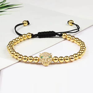 Luxury CZ diamond Puma charm bead macrame bracelet by T.M.J featuring intricate knotting and sparkling gemstone accents.