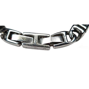 Stainless steel Meridian Balinese J-Link horseshoe bracelet by T.M.J, featuring intricate metal construction and horseshoe design.