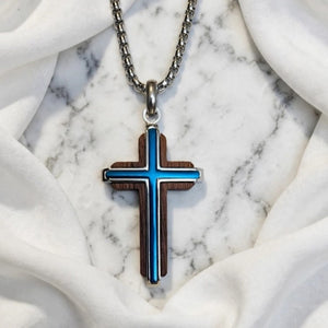 Dresden Black Walnut Cross by Cudworth featuring a channel-set blue steel accent, crafted with polished black walnut wood.