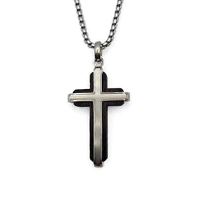 Dresden ebony wood cross by Cudworth featuring channel-set satin steel accents, showcasing intricate craftsmanship.