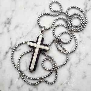 Dresden ebony wood cross by Cudworth featuring a channel-set satin steel accent, showcasing intricate craftsmanship and smooth polished finish.