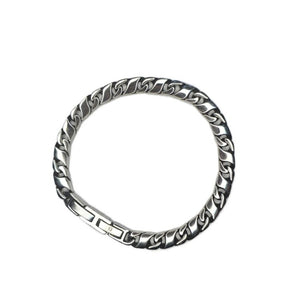 Titan Flat Cuban Curb Chain Bracelet by T.M.J in stainless steel, showcasing a sleek, flat Cuban curb link design.