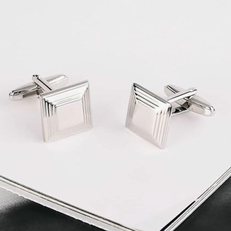 Plain metal engraved men's cufflinks by T.M.J with a square and ridged design in silver tone
