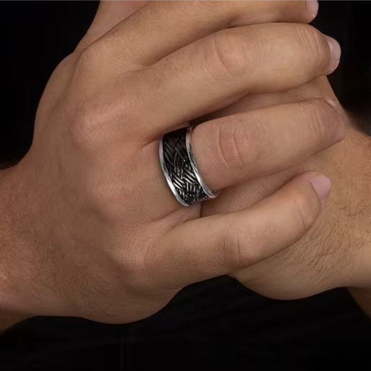 Hoxton men's sterling silver ring featuring a unique woven design, showcasing intricate craftsmanship and modern style.