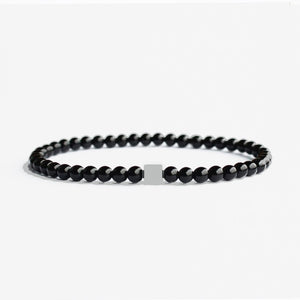 Polished black onyx beaded bracelet by T.M.J featuring matte black onyx and stainless steel beads, 17cm length, 4mm beads.