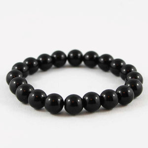 Polished black onyx beaded bracelet from T.M.J, 17cm, 4mm round beads, stylish jewelry accessory.