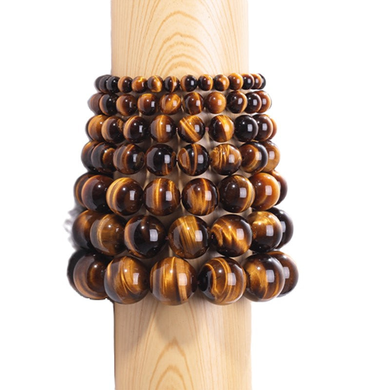 Tiger Eye and silver bead bracelet featuring 17mm and 4mm beads from T.M.J, showcasing polished tiger eye stones and silver accents.