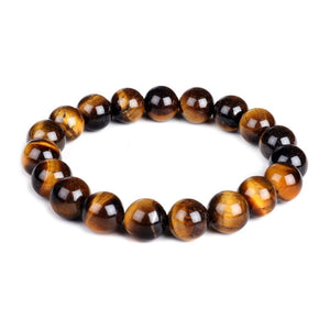 Tiger Eye and silver bead bracelet featuring 17mm and 4mm beads, crafted by T.M.J, showcasing a stylish beaded jewelry design.