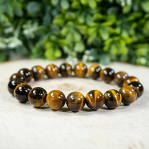 Tiger Eye and silver bead bracelet with 17mm and 4mm beads from T.M.J, showing the polished tiger eye stones and silver accents.