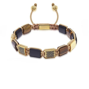 T.M.J Eye of Dharma flatbead bracelet with matte black onyx and brown tiger eye beads, showcasing natural stone textures and colors.