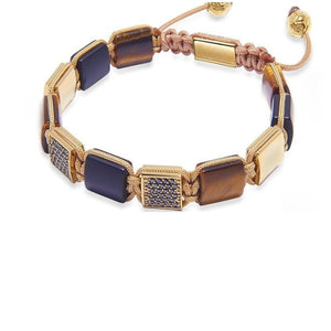 T.M.J Eye of Dharma Flatbead Collection bracelet with matte onyx and brown tiger eye beads, showcasing natural stone textures.