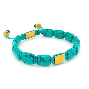 Turquoise and gold bead bracelet from T.M.J Eye of Dharma Flatbead Collection, featuring vibrant turquoise stones and gold accents.