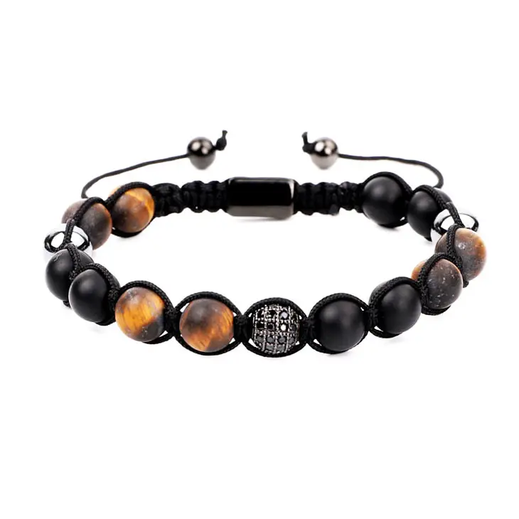 Beaded macrame bracelet featuring natural onyx and tiger eye stones, crafted by T.M.J with matte finish and intricate knotting.
