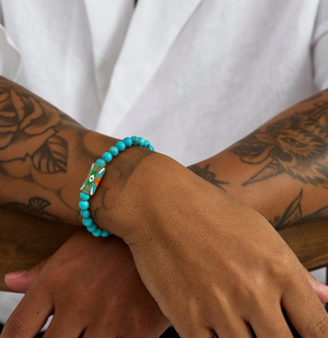 T.M.J beaded bracelet with turquoise evil eye and love protector charms, 17cm, 6mm beads, stylish and meaningful jewelry piece.