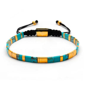 Tila Link Macrame Bracelet with Miyuki Tila beads by T.M.J, featuring white and gold bead accents and intricate knot design.