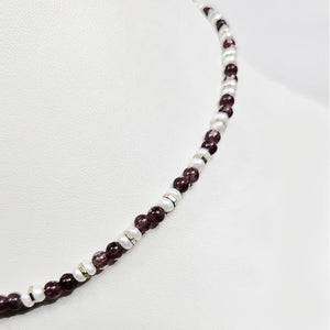 Mini beaded necklace by T.M.J featuring pearls and lapidolite beads, 45cm length, with delicate and colorful gemstone accents.