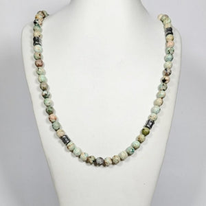 Peruvian turquoise and sterling silver beaded necklace by T.M.J, 45cm, featuring vibrant turquoise beads and silver accents.