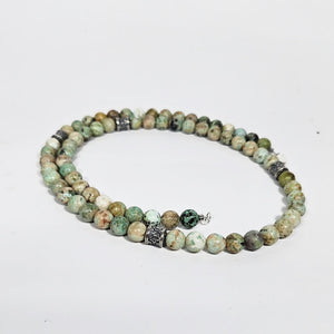 Peruvian turquoise and sterling silver beaded necklace, 45cm, featuring vibrant turquoise beads and silver accents by T.M.J.