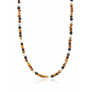 Beaded necklace featuring brown tiger eye, howlite, and onyx beads, crafted by T.M.J, showcasing natural stone variations.