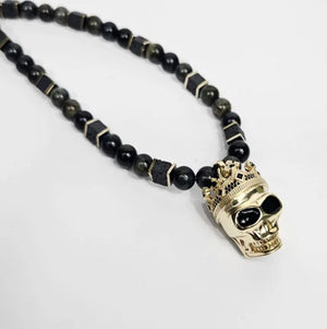 Large silver and gold plated skull with crown pendant on blue tiger eye beaded necklace, T.M.J beaded jewelry.