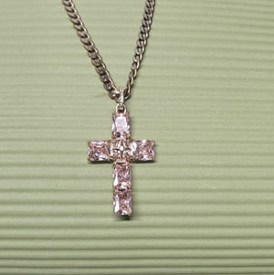 Silver and rose gold-plated beaded cross necklace by T.M.J with pink Austrian crystals and intricate pendant detail.