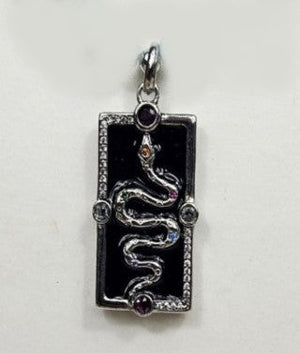 Silver enamel snake dog tag pendant on a turquoise beaded necklace, featuring a detailed T.M.J beaded necklace design.