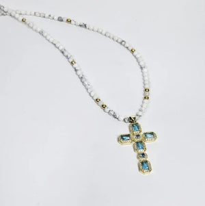 Solenne silver gold-plated cross with aquamarine crystals on faceted howlite bead necklace, T.M.J beaded jewelry.
