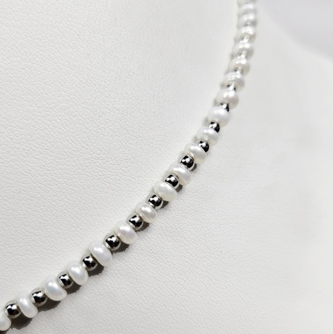 Mini beaded necklace by T.M.J featuring pearls and stainless steel spacer beads, 45cm silver-toned jewelry accessory.