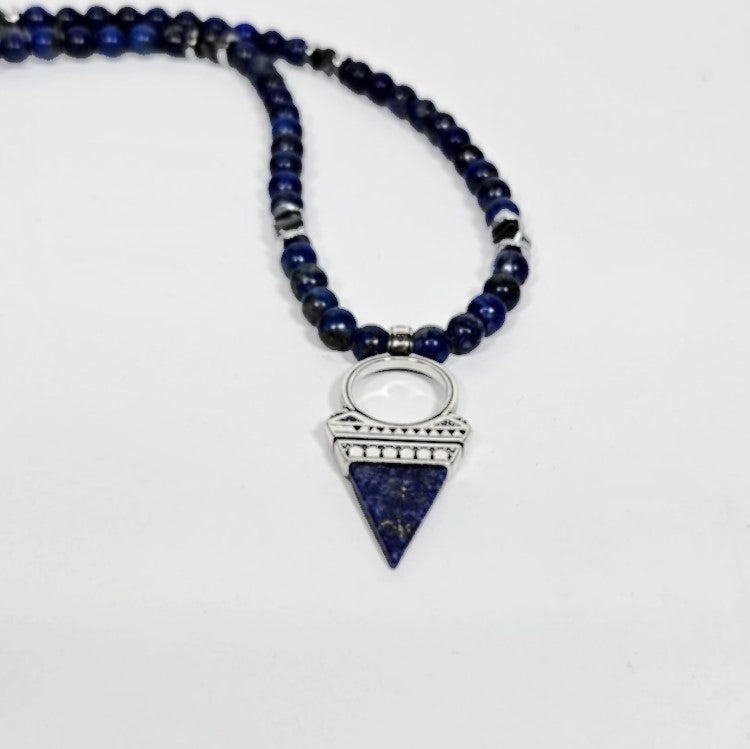 T.M.J lapis lazuli beaded necklace with silver pendant, featuring deep blue lapis lazuli stones and intricate silver detailing.