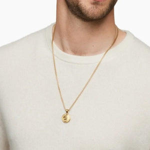 Gold Nemean Lion Greek Mythology pendant on beaded necklace, T.M.J, detailed lion face with intricate beadwork.