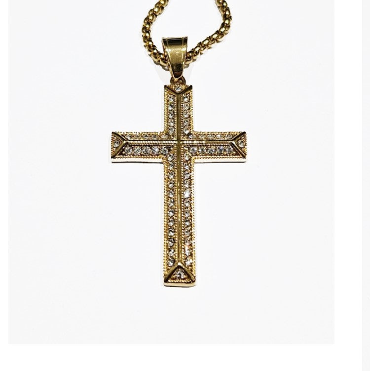 Corwin stainless steel cross pendant with gold PVD satin finish, featuring a sleek, polished design and T.M.J branding.