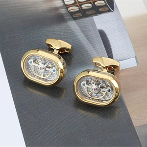 Handmade gold plated watch movement cufflinks by T.M.J featuring intricate mechanical watch parts on a polished finish.