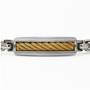 Stainless steel ID bracelet by T.M.J with gold twisted wire insert, featuring a sleek metal design and adjustable clasp.