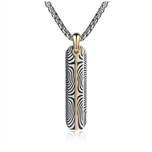 Damascus steel slim dog tag pendant with gold accent and chain, T.M.J brand, featuring a sleek, modern design.