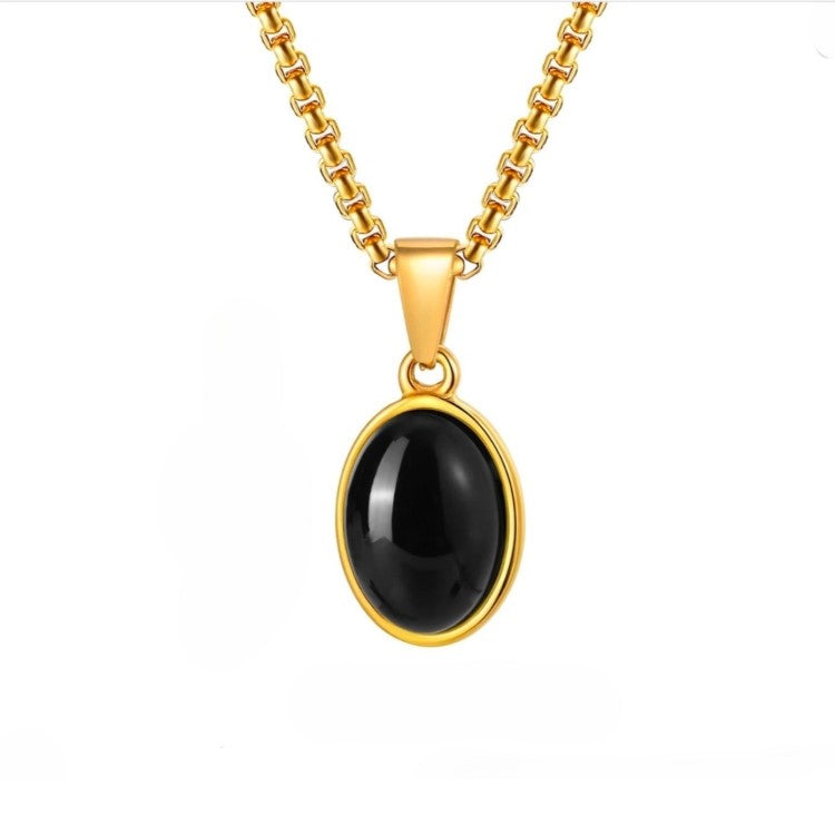 Gold-plated steel pendant with black agate cabochon from T.M.J, featuring a sleek, elegant design and polished finish.