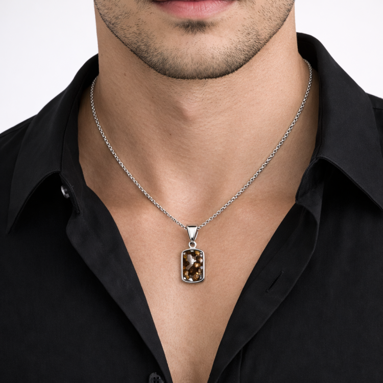 Sterling silver Pallasite meteorite pendant with green olivine crystal inclusions, featuring a polished, handcrafted jewelry design.