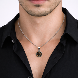 Sterling silver pendant featuring Pallasite meteorite with green olivine crystal inclusions, designed by T.M.J.