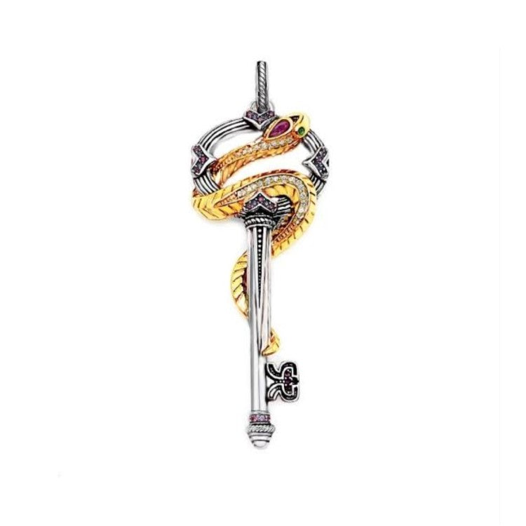 Silver and gold plated snake pendant with a key and crystal accents from T.M.J, featuring intricate details and shiny finish.